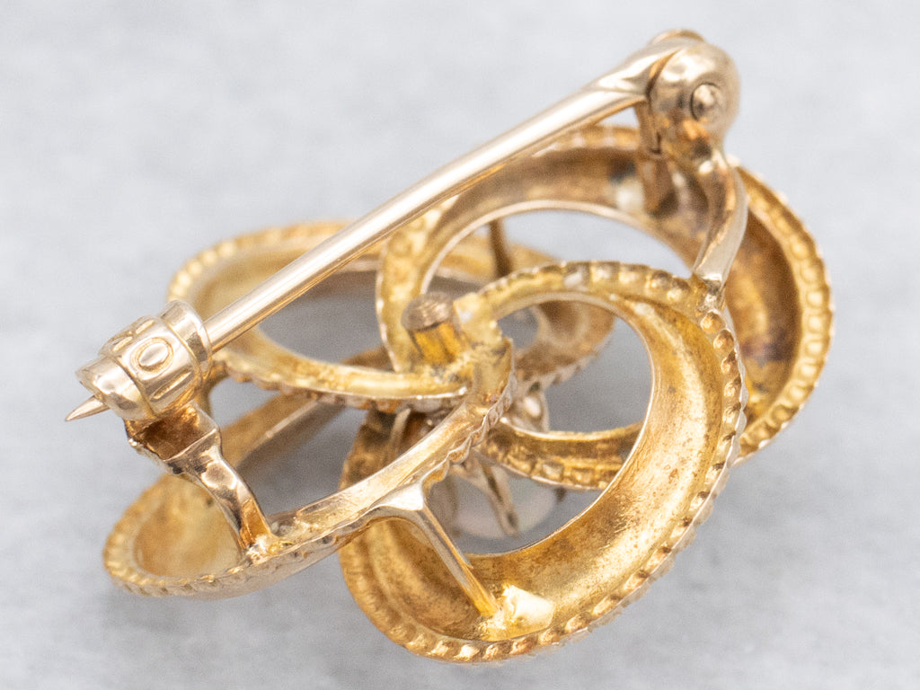 Antique Gold Lover's Knot Brooch with Opal Center