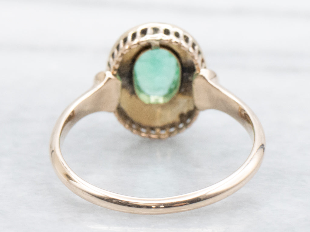 Antique Emerald and Seed Pearl Halo Gold Ring