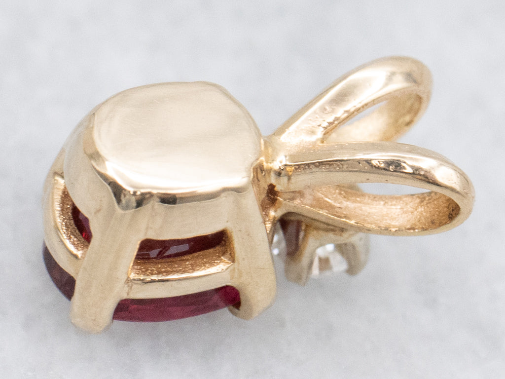 Oval-Cut Ruby and Diamond Gold Pendant with Split Bail