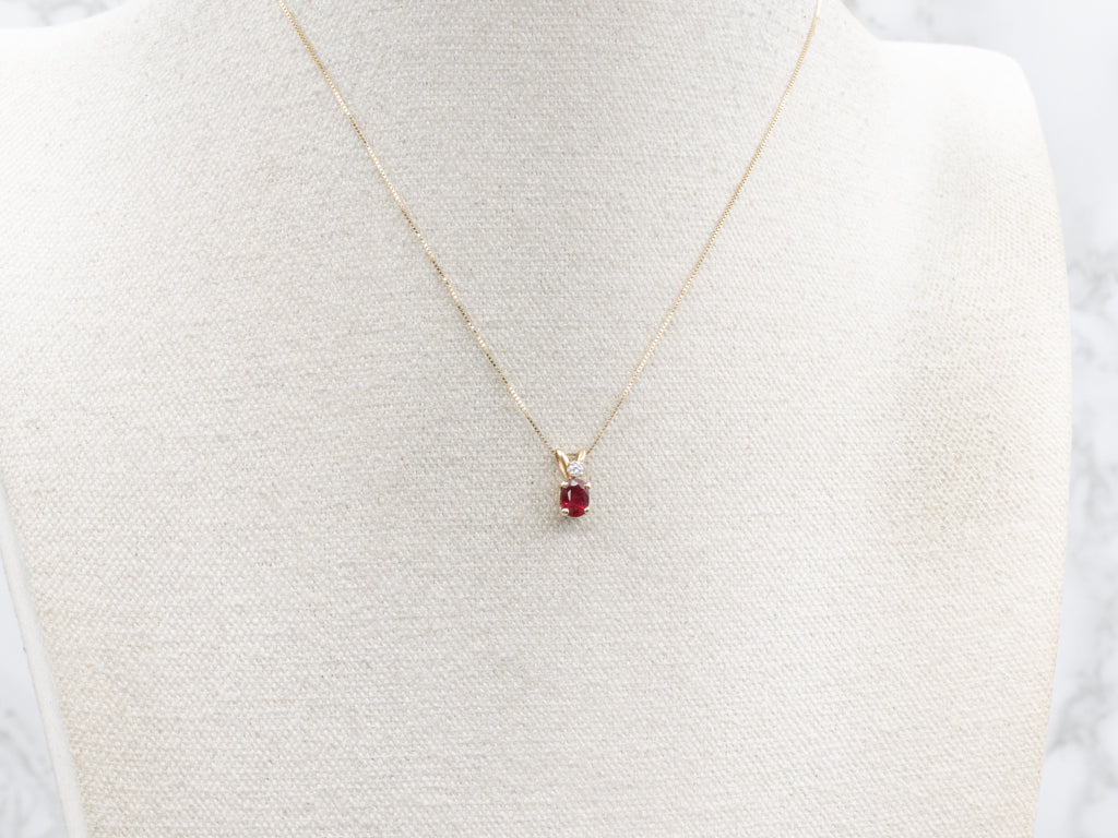 Oval-Cut Ruby and Diamond Gold Pendant with Split Bail
