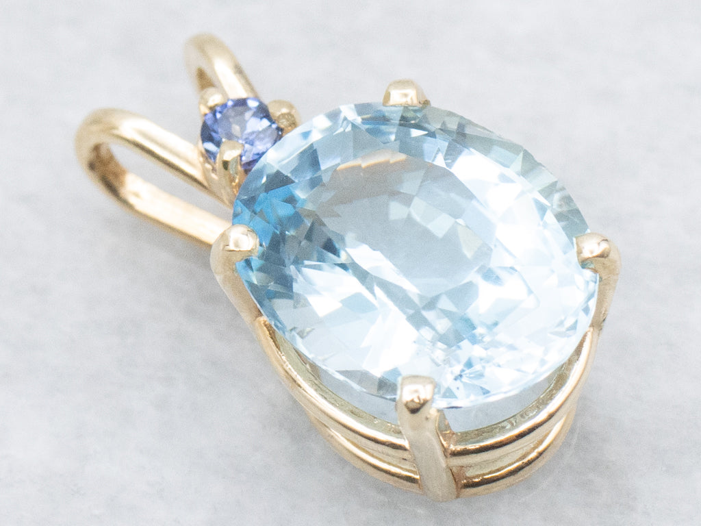 Yellow Gold Blue Topaz Pendant with Sapphire Accent