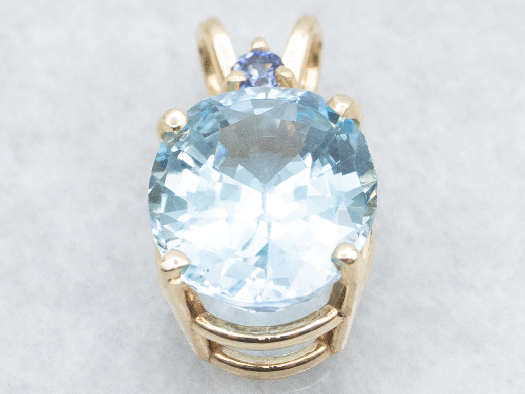 Yellow Gold Blue Topaz Pendant with Sapphire Accent