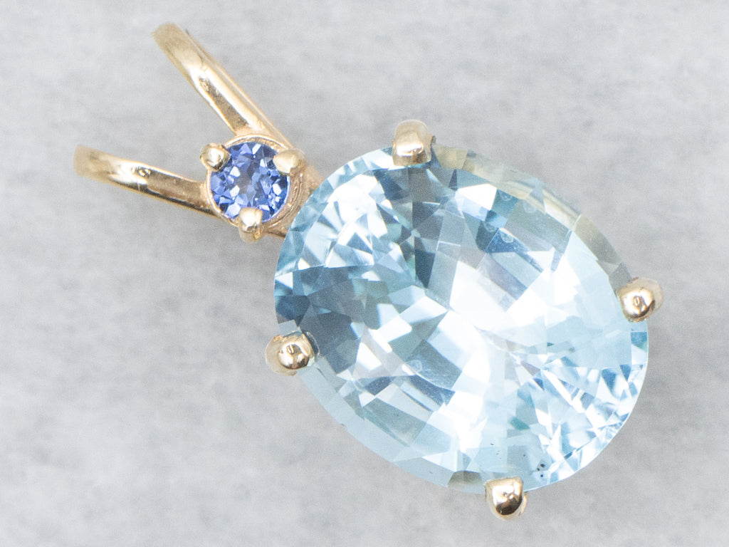 Yellow Gold Blue Topaz Pendant with Sapphire Accent