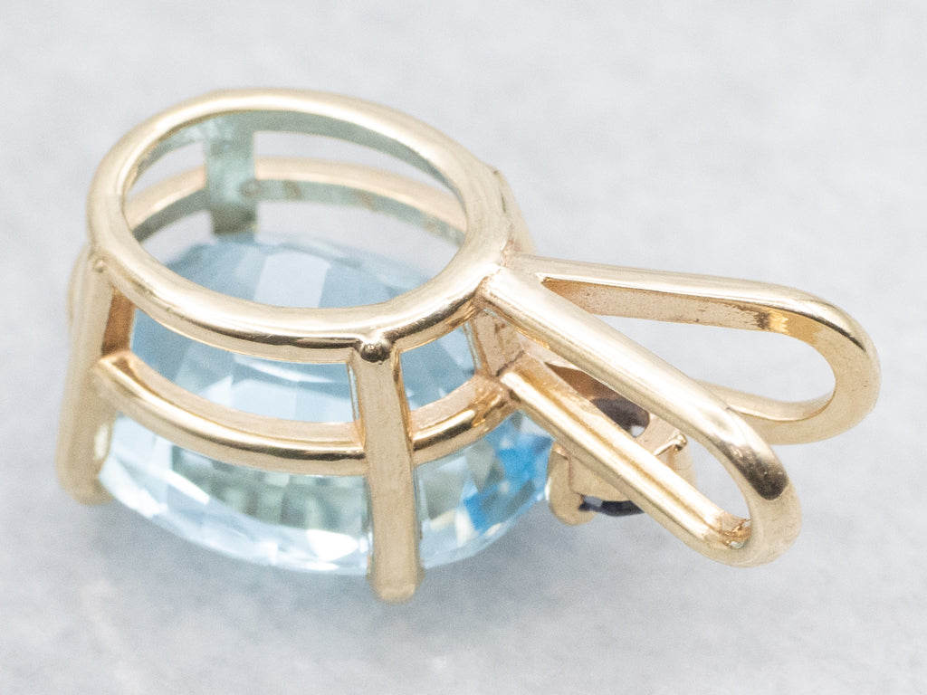 Yellow Gold Blue Topaz Pendant with Sapphire Accent