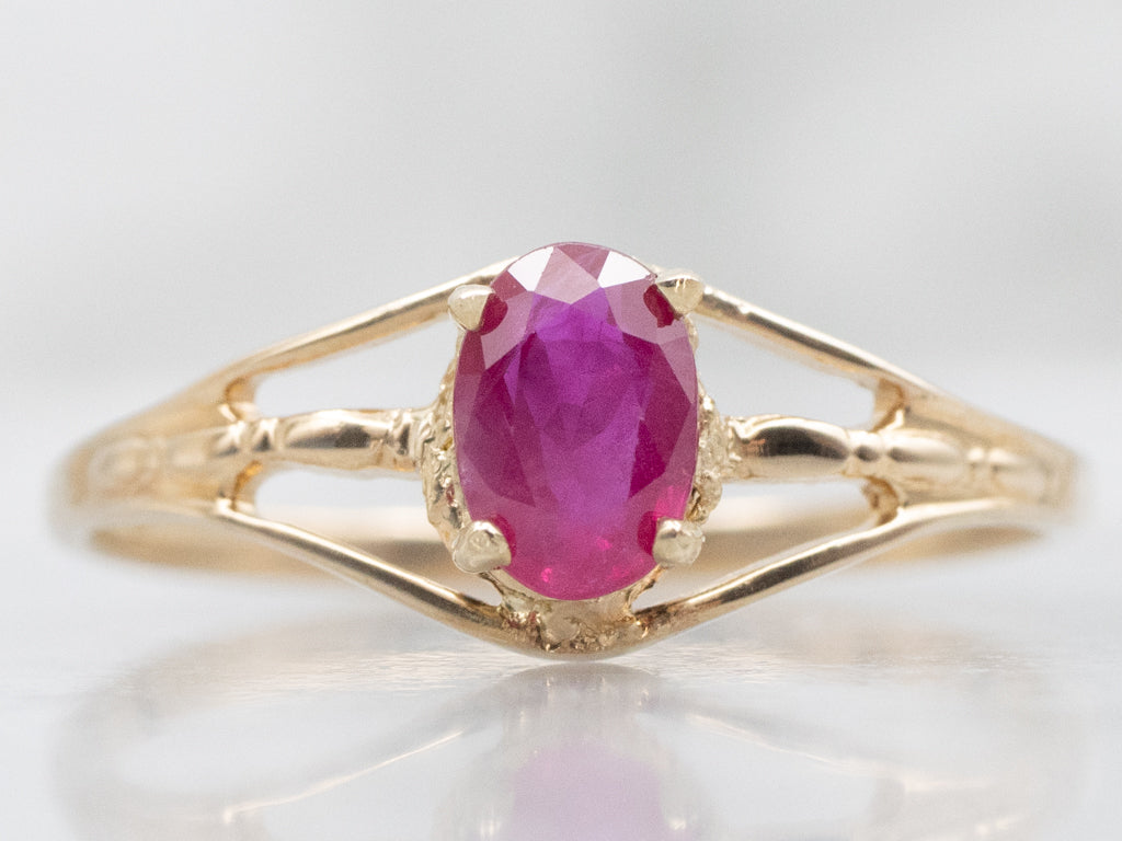 Oval-Cut Ruby Split Shank Gold Solitaire Ring
