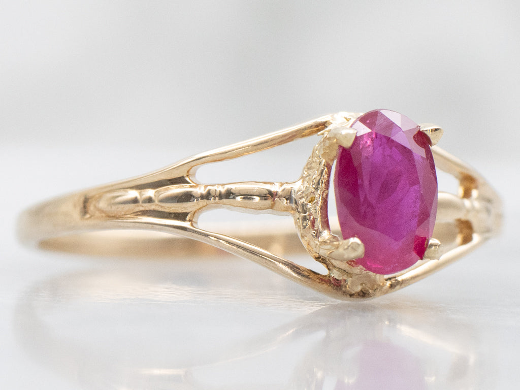 Oval-Cut Ruby Split Shank Gold Solitaire Ring