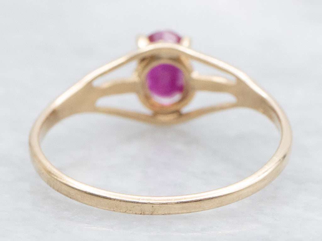 Oval-Cut Ruby Split Shank Gold Solitaire Ring