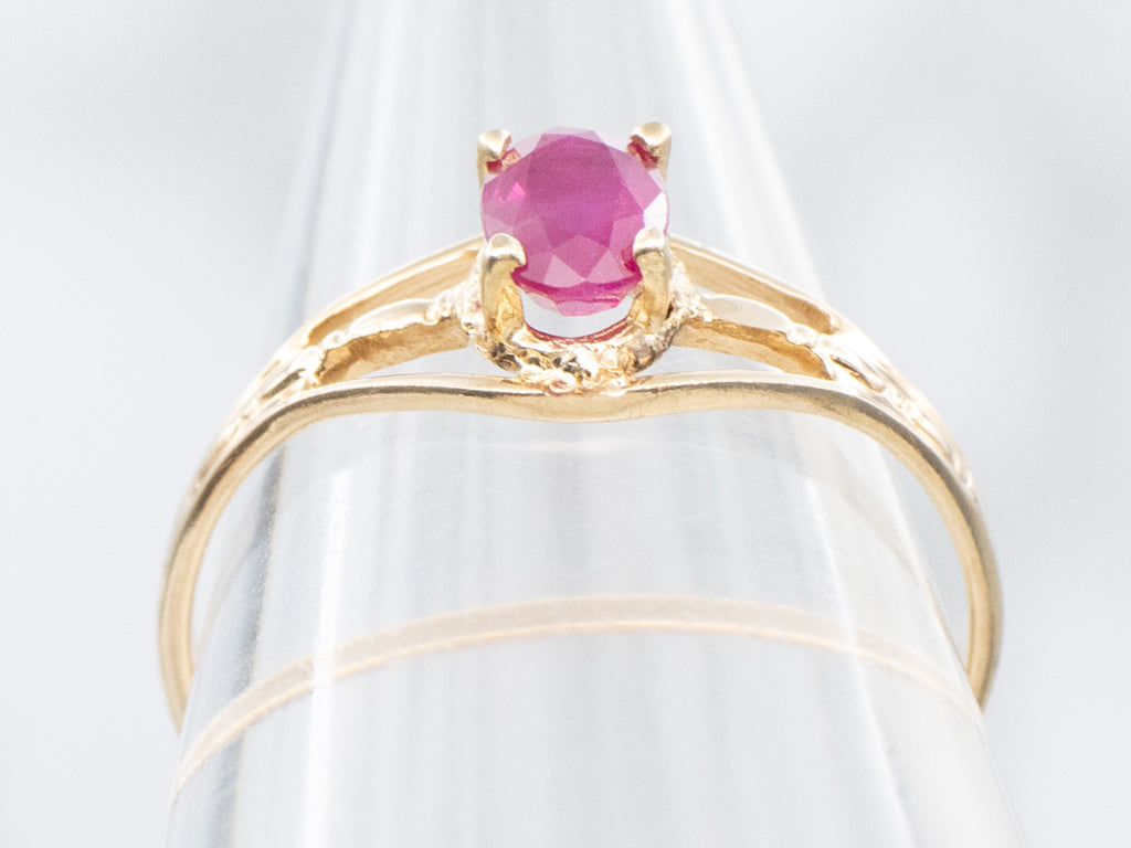 Oval-Cut Ruby Split Shank Gold Solitaire Ring