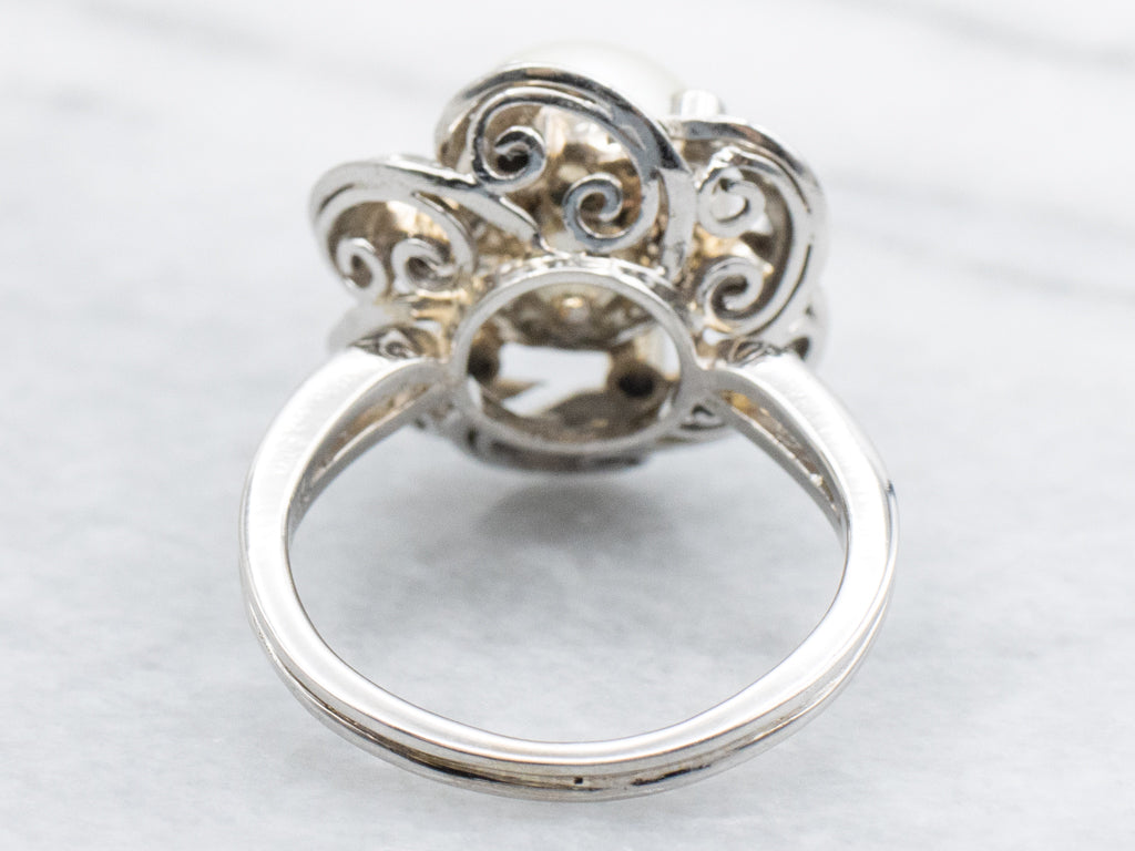 Vintage White Gold Pearl and Diamond Halo Ring