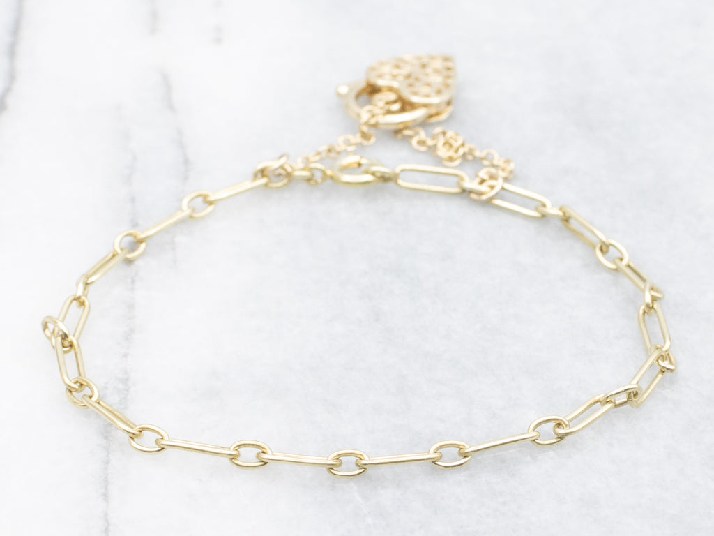 Yellow Gold Alternating Oval Link Bracelet with Floral Filigree Padlock Heart