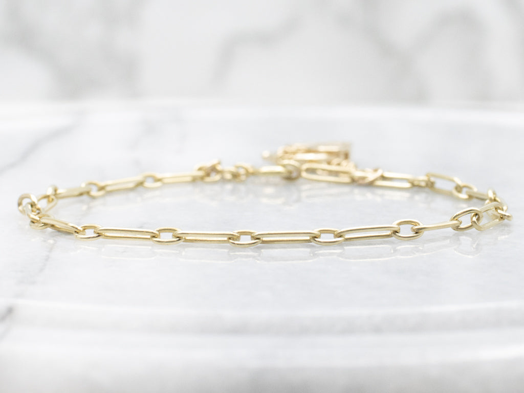 Yellow Gold Alternating Oval Link Bracelet with Floral Filigree Padlock Heart