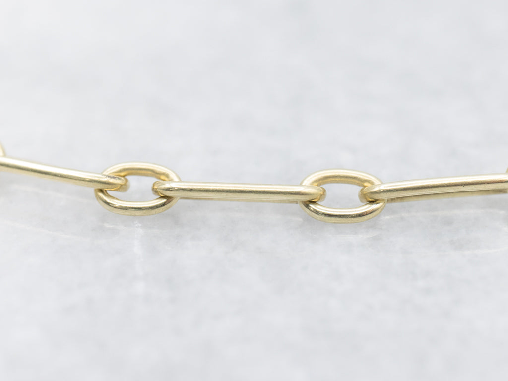 Yellow Gold Alternating Oval Link Bracelet with Floral Filigree Padlock Heart