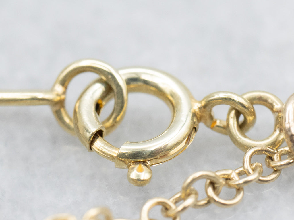 Yellow Gold Alternating Oval Link Bracelet with Floral Filigree Padlock Heart