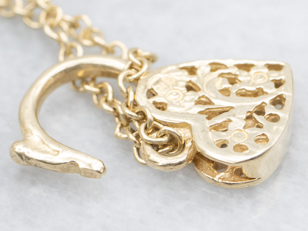 Yellow Gold Alternating Oval Link Bracelet with Floral Filigree Padlock Heart