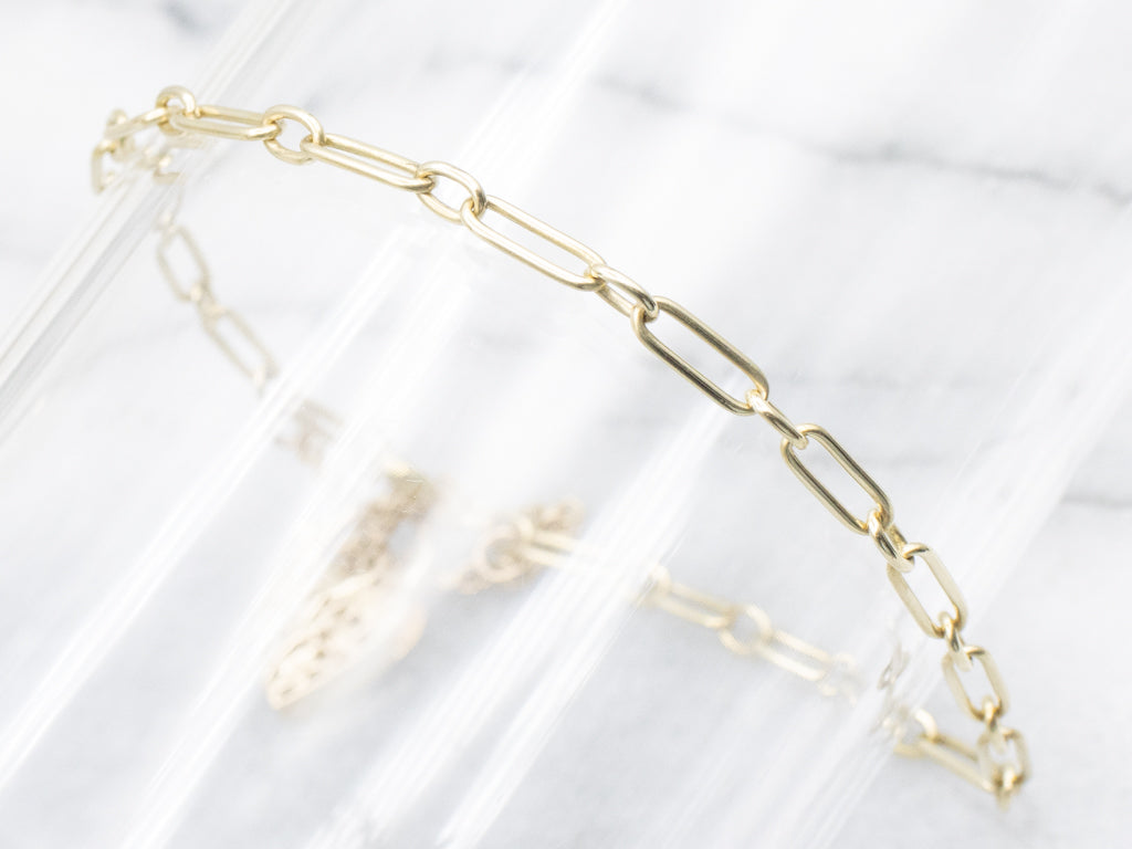 Yellow Gold Alternating Oval Link Bracelet with Floral Filigree Padlock Heart