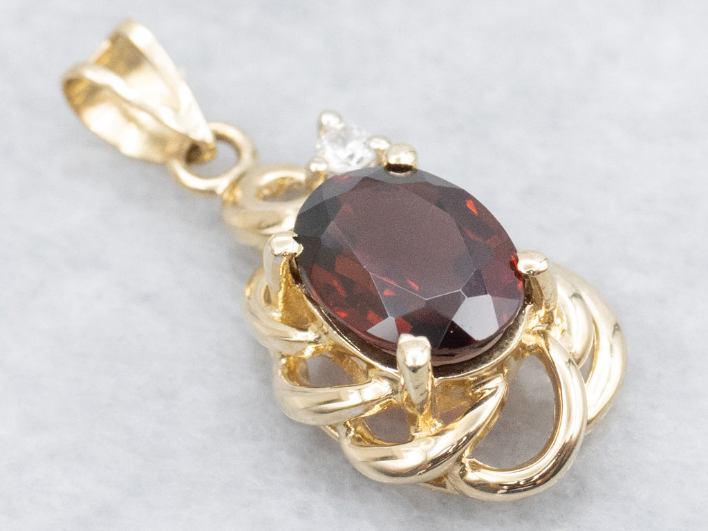 Looping Gold Garnet and Diamond Pendant