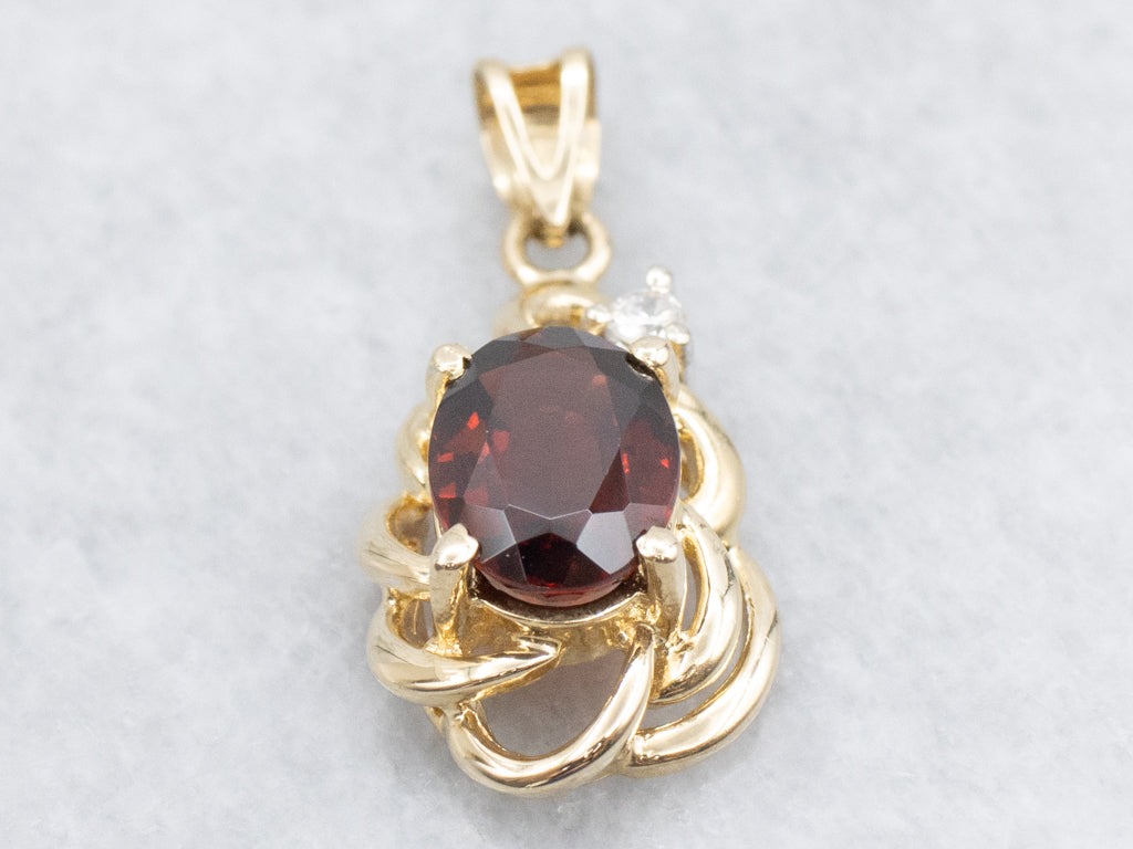 Looping Gold Garnet and Diamond Pendant