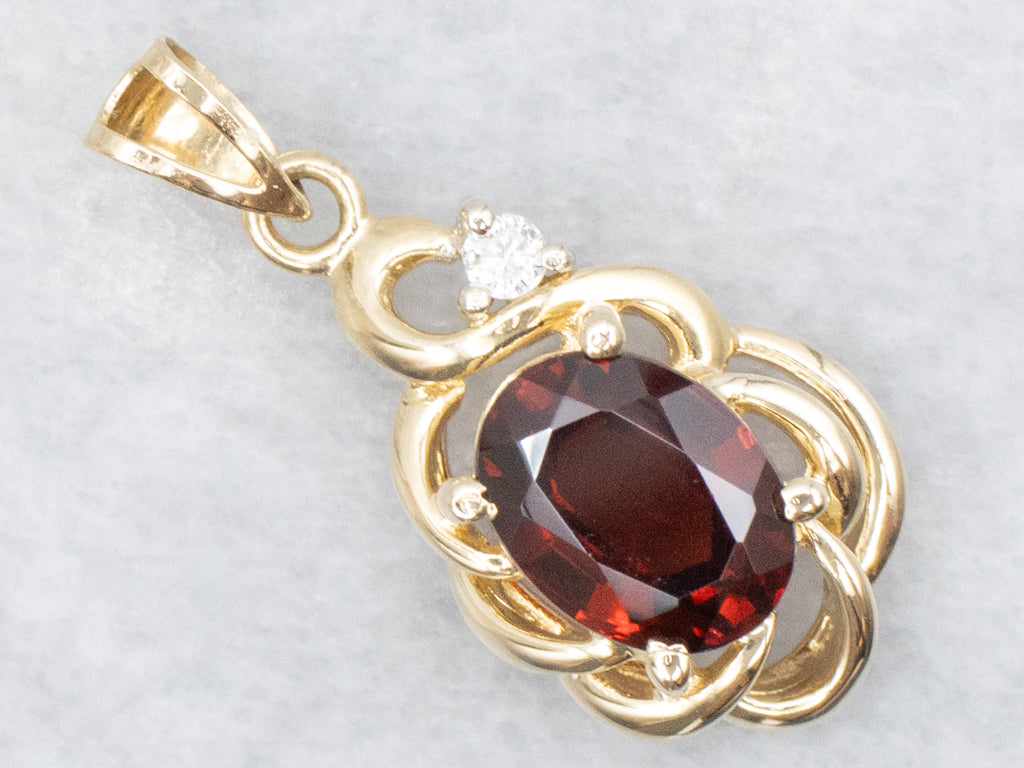 Looping Gold Garnet and Diamond Pendant