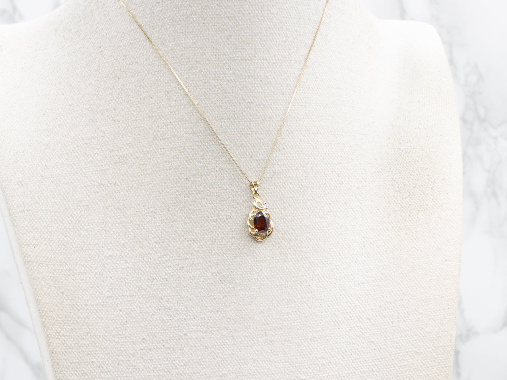 Looping Gold Garnet and Diamond Pendant