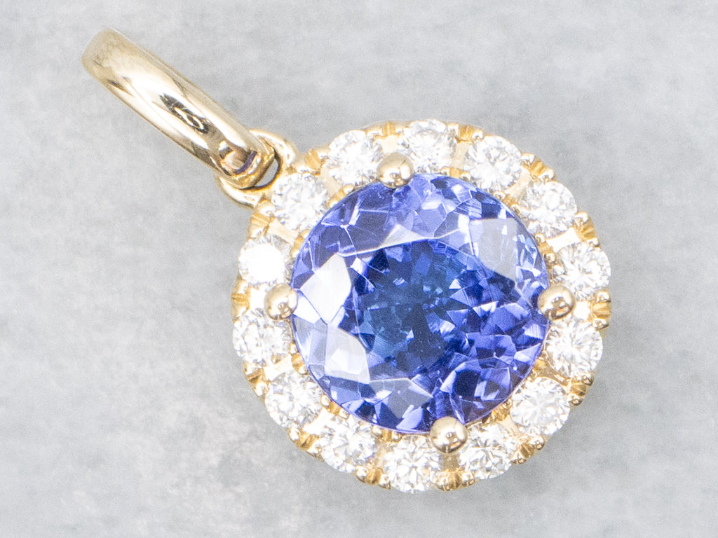 Modern Tanzanite and Diamond Halo Gold Pendant