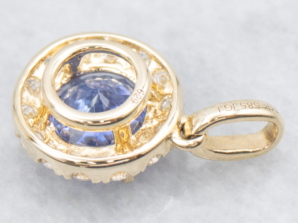 Modern Tanzanite and Diamond Halo Gold Pendant