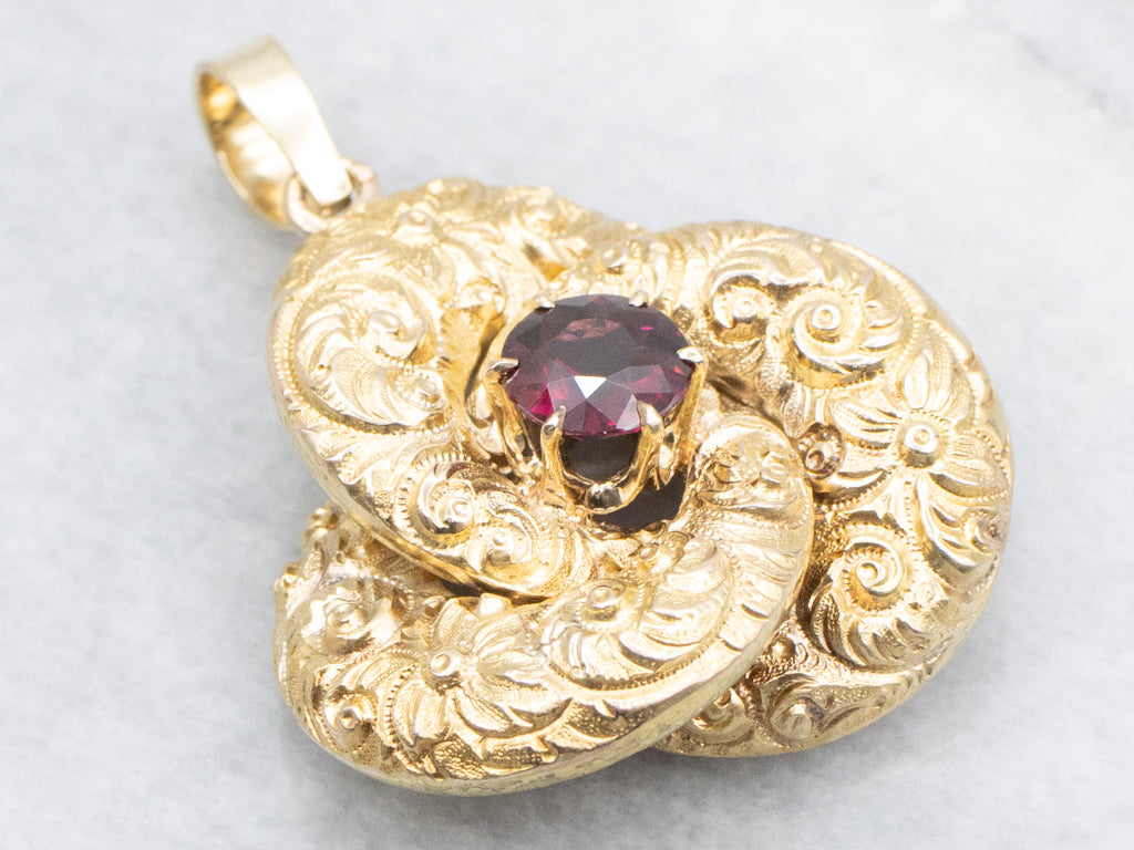 Antique Scrolling Gold and Garnet Lovers Knot Pendant
