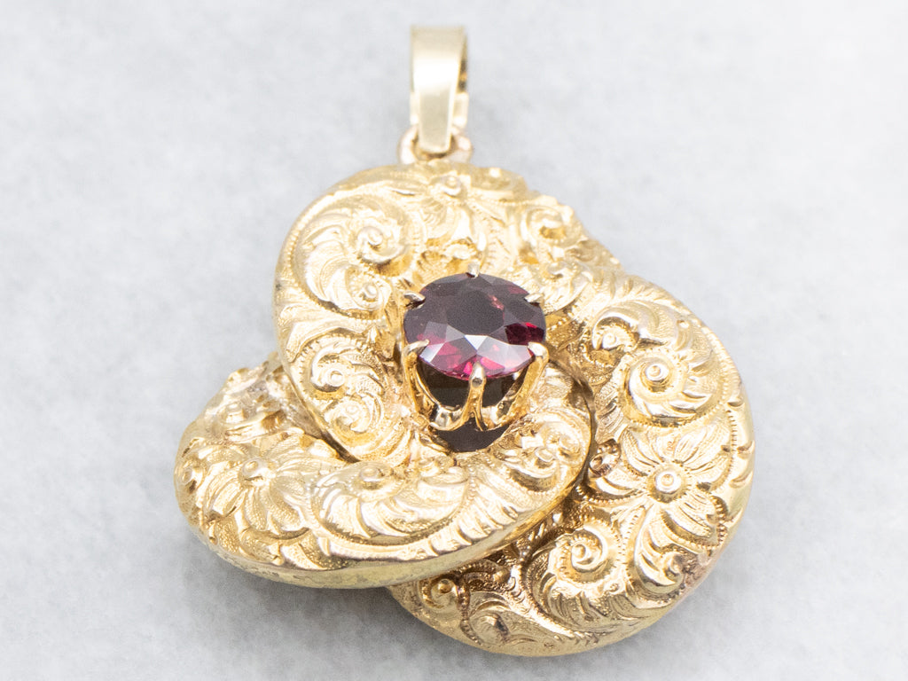 Antique Scrolling Gold and Garnet Lovers Knot Pendant