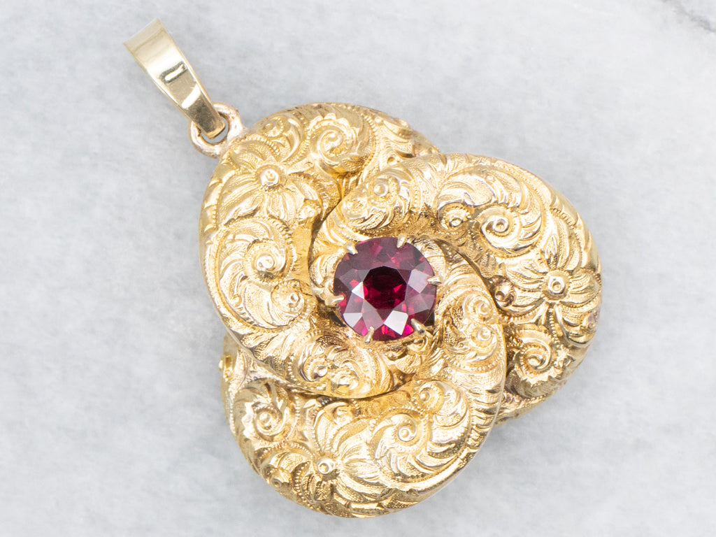 Antique Scrolling Gold and Garnet Lovers Knot Pendant