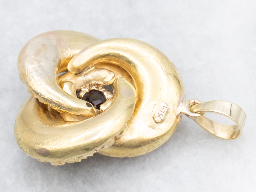 Antique Scrolling Gold and Garnet Lovers Knot Pendant
