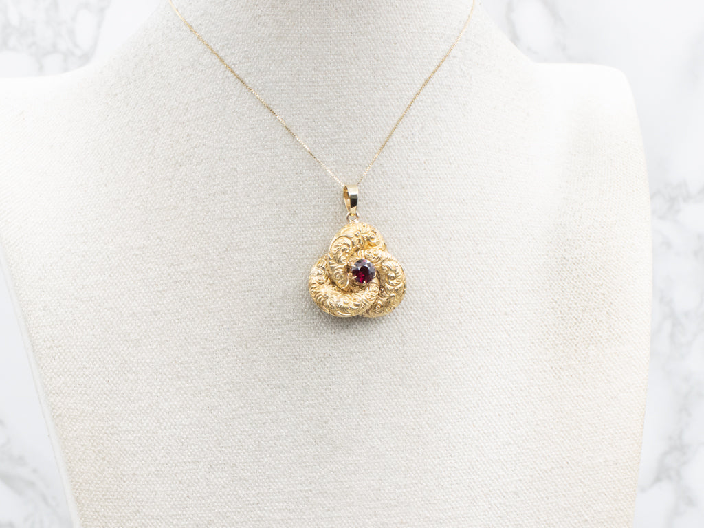 Antique Scrolling Gold and Garnet Lovers Knot Pendant