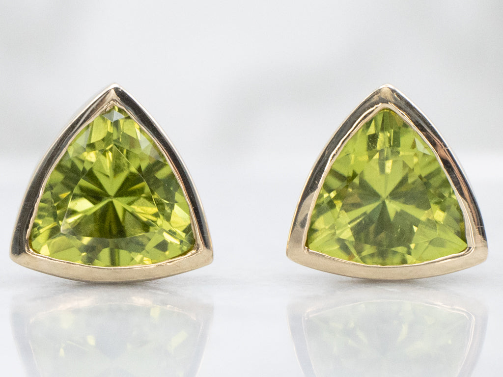 Sleek Bezel-Set Trillion-Cut Peridot Gold Stud Earrings