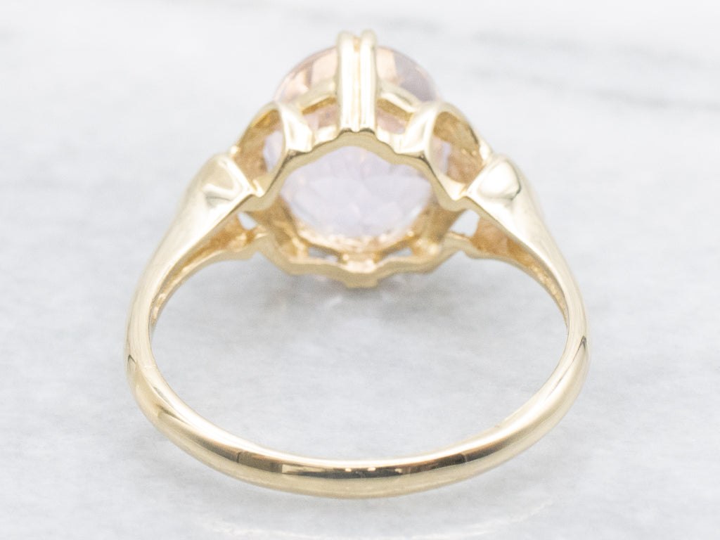 Oval-Cut Kunzite Yellow Gold Solitaire Ring