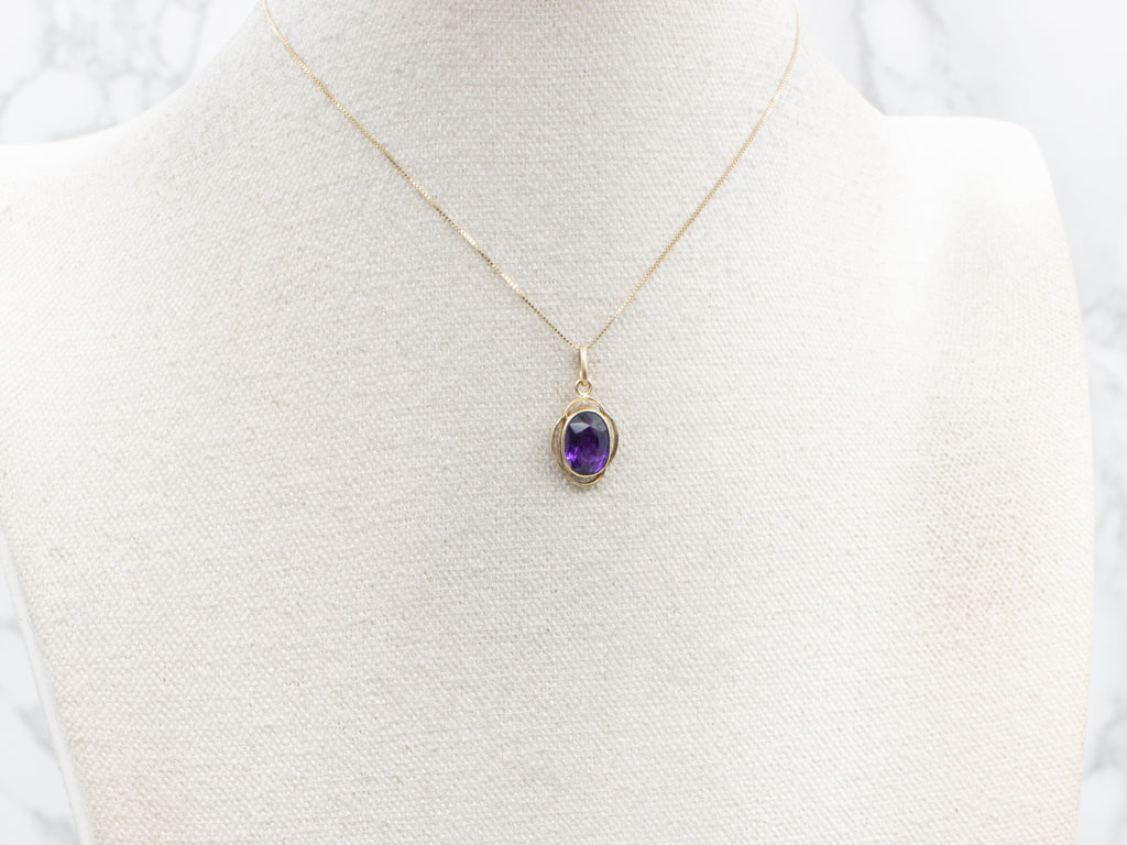 Bezel-Set Amethyst and Gold Pendant
