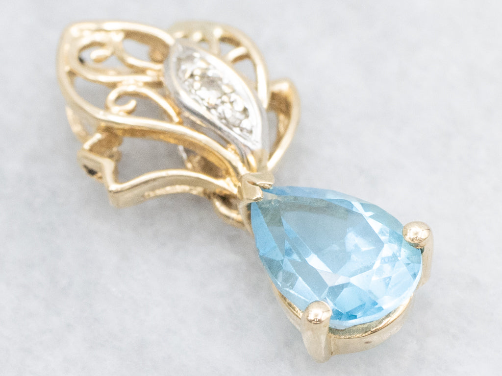 Scrolling Gold Pear-Cut Blue Topaz Pendant with Diamonds