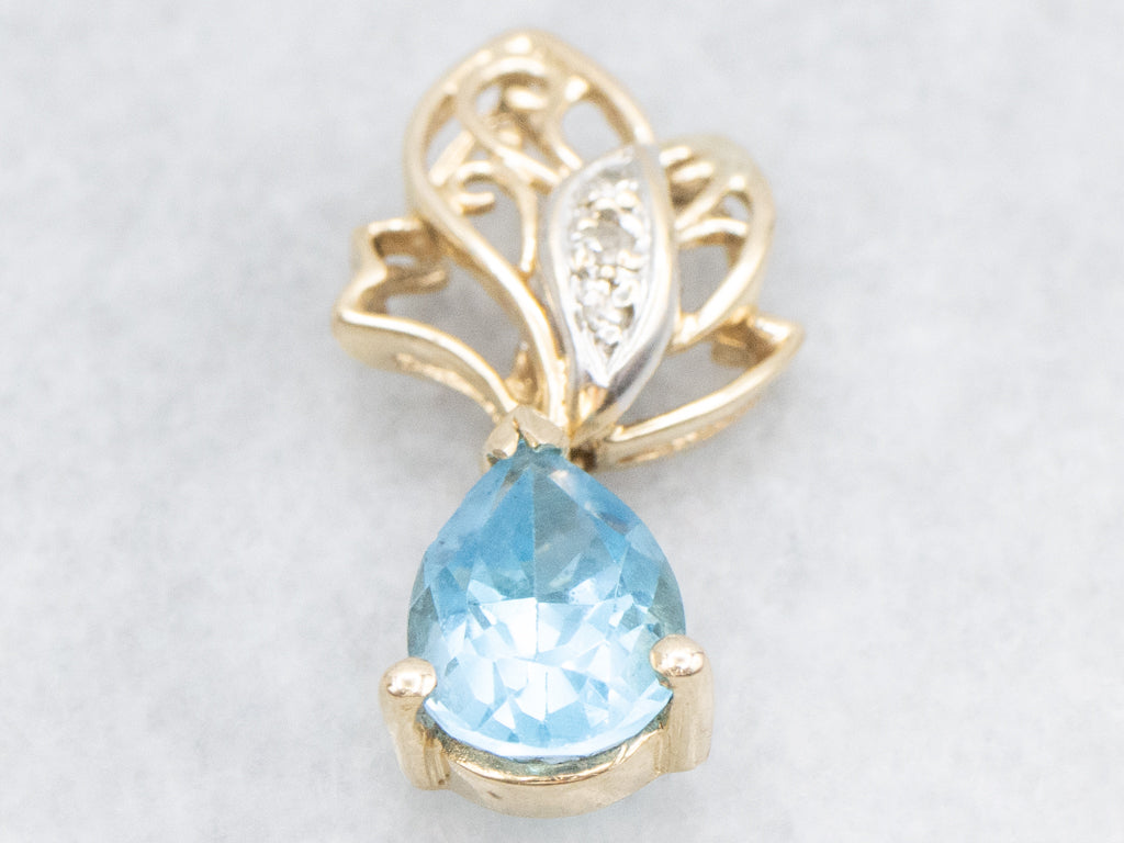 Scrolling Gold Pear-Cut Blue Topaz Pendant with Diamonds