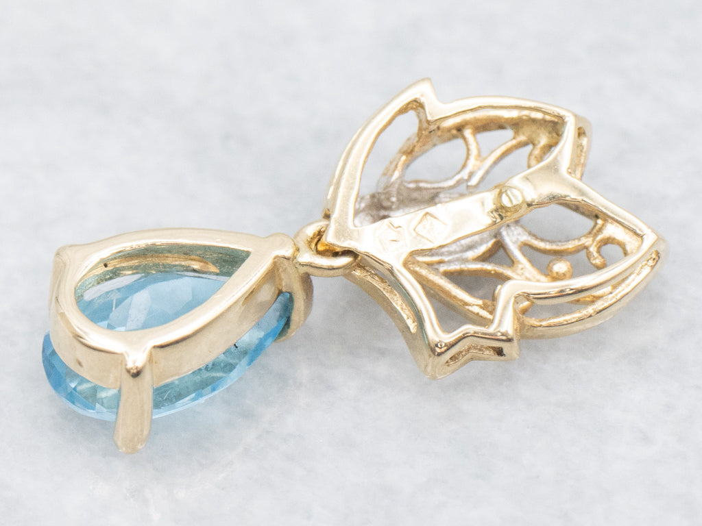 Scrolling Gold Pear-Cut Blue Topaz Pendant with Diamonds