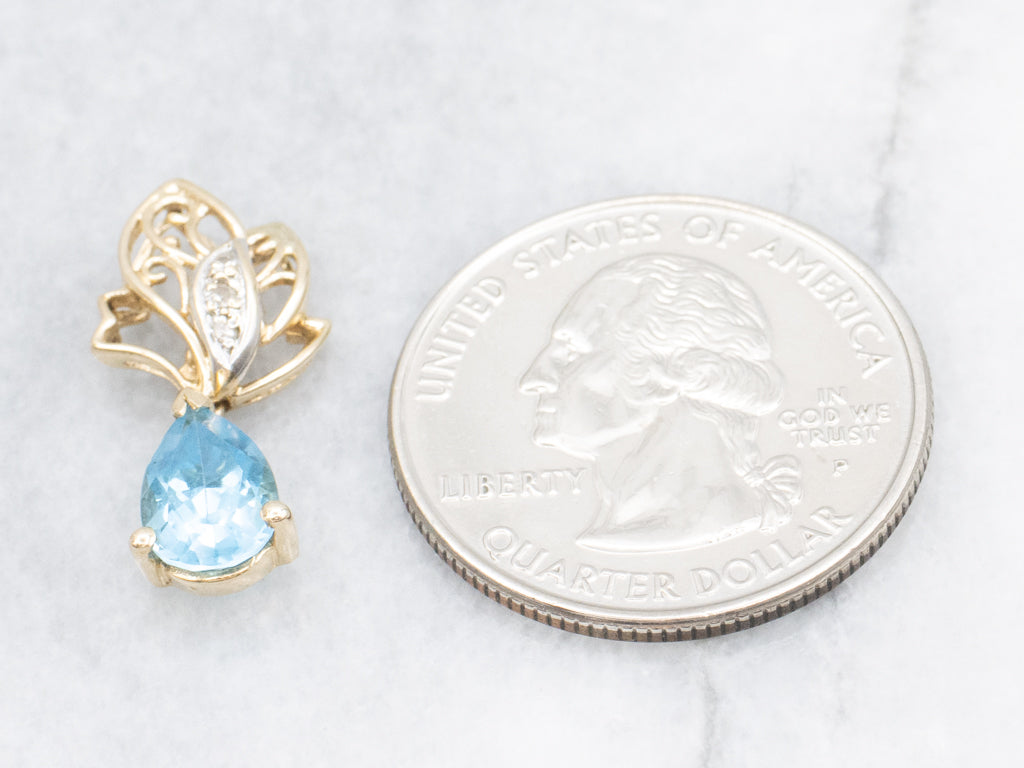 Scrolling Gold Pear-Cut Blue Topaz Pendant with Diamonds