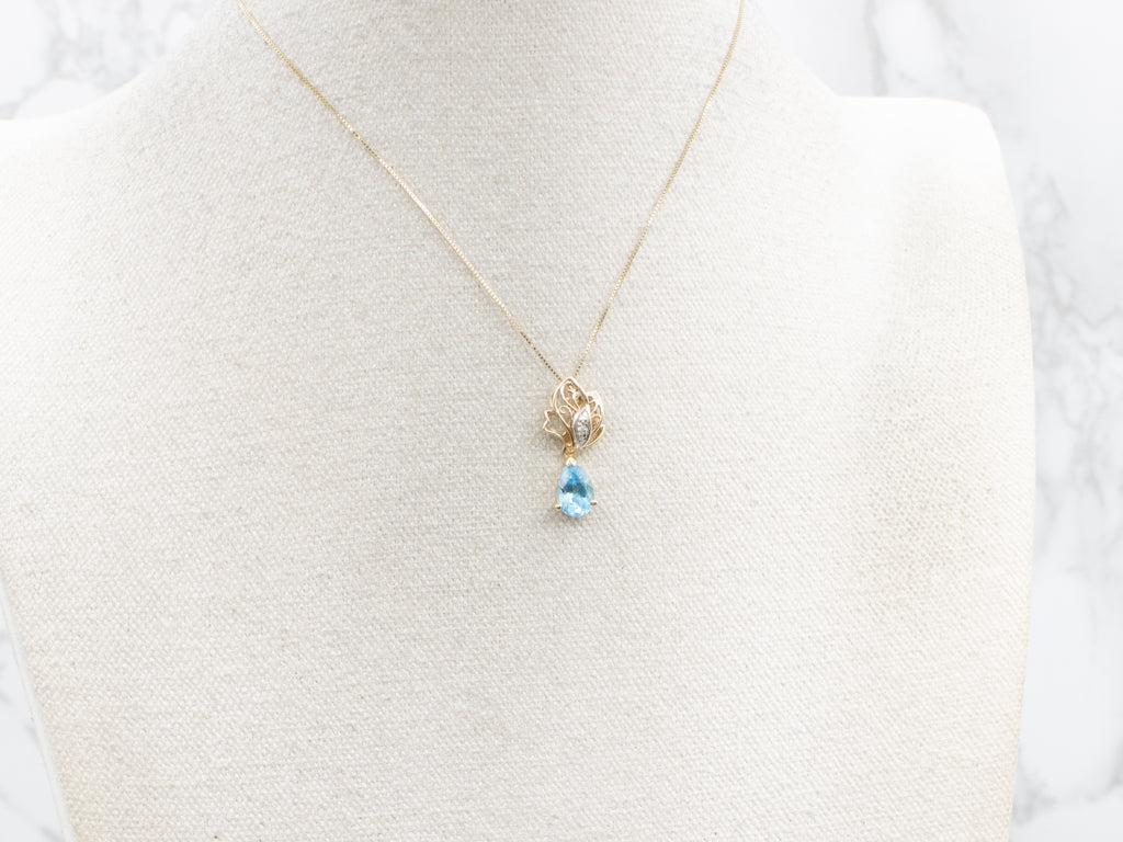 Scrolling Gold Pear-Cut Blue Topaz Pendant with Diamonds