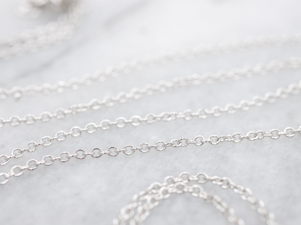 Modern Sapphire and Diamond Halo Pendant Necklace