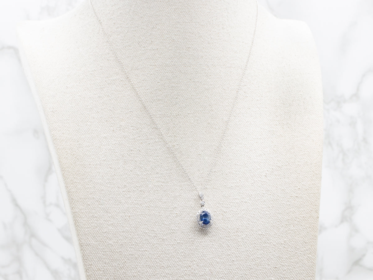 Modern Sapphire and Diamond Halo Pendant Necklace