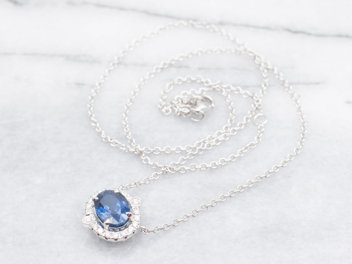 Modern East-to-West Sapphire and Diamond Halo Pendant on Cable Chain