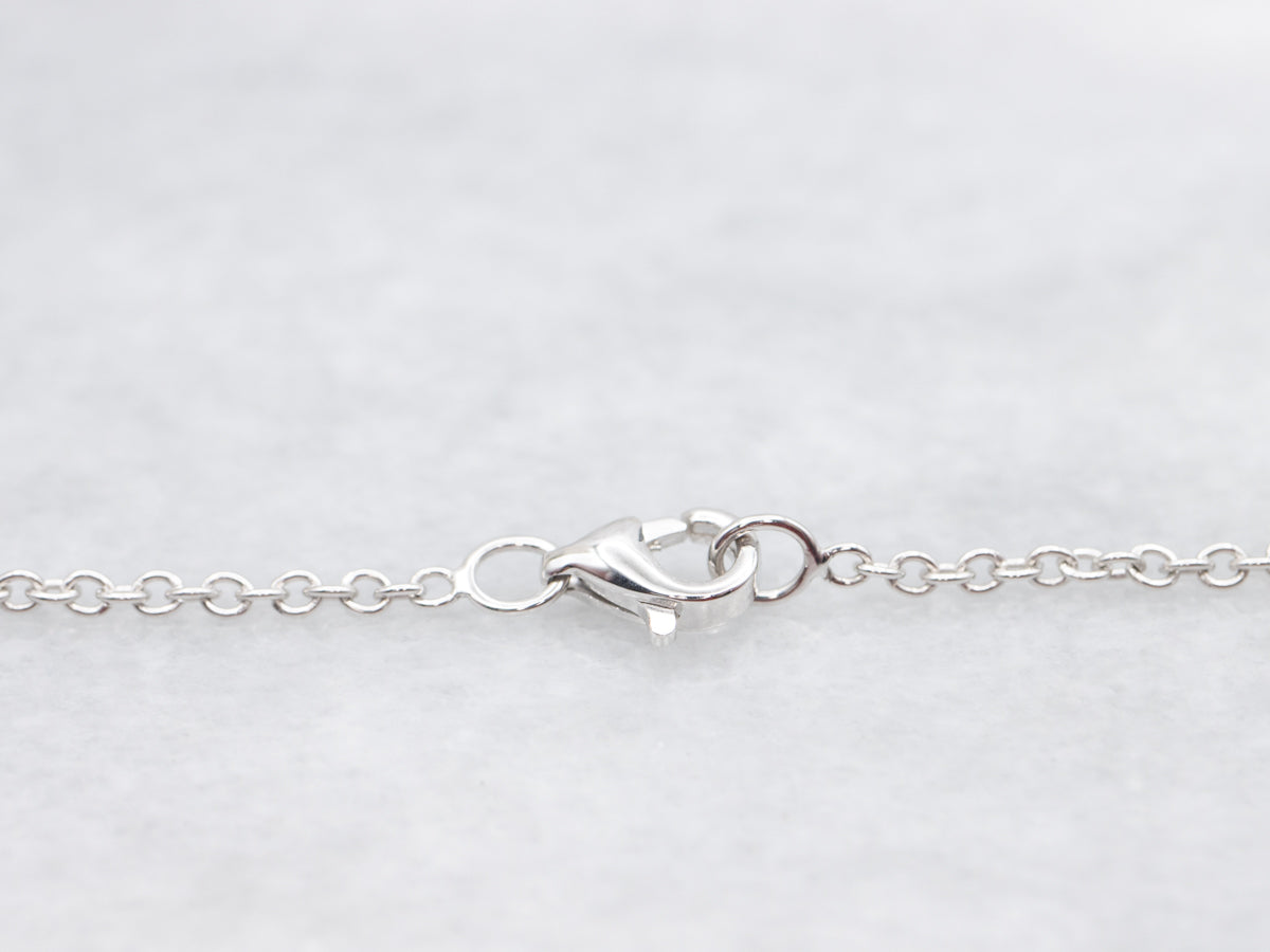 Modern East-to-West Sapphire and Diamond Halo Pendant on Cable Chain