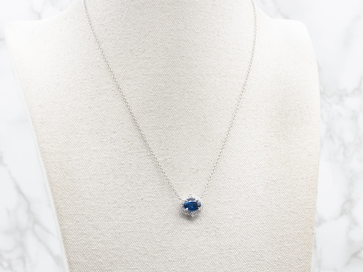 Modern East-to-West Sapphire and Diamond Halo Pendant on Cable Chain
