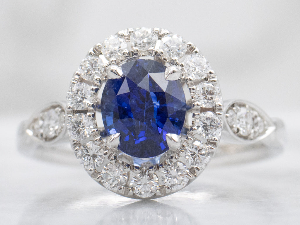 Blue Sapphire and Diamond Halo Ring in 18K White Gold
