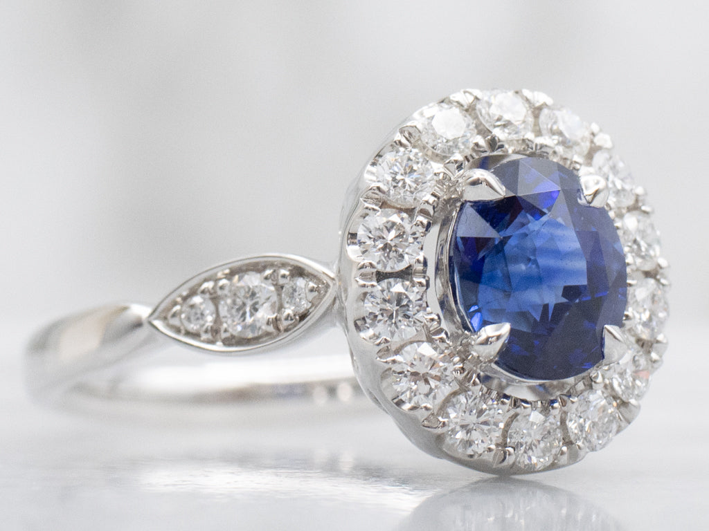 Blue Sapphire and Diamond Halo Ring in 18K White Gold