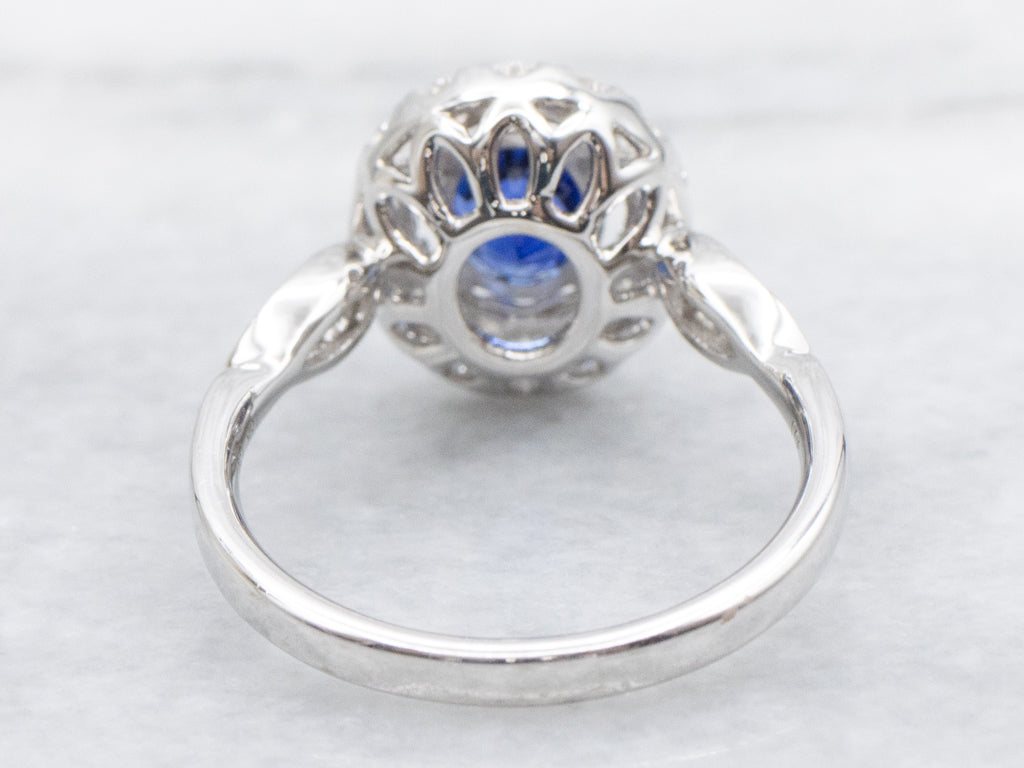 Blue Sapphire and Diamond Halo Ring in 18K White Gold