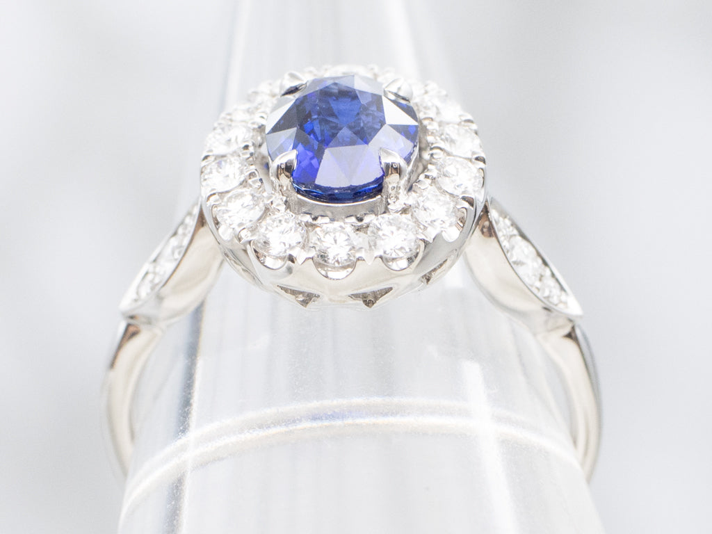 Blue Sapphire and Diamond Halo Ring in 18K White Gold