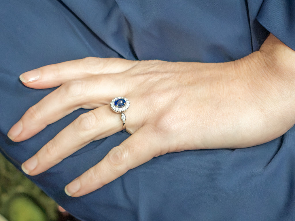 Blue Sapphire and Diamond Halo Ring in 18K White Gold