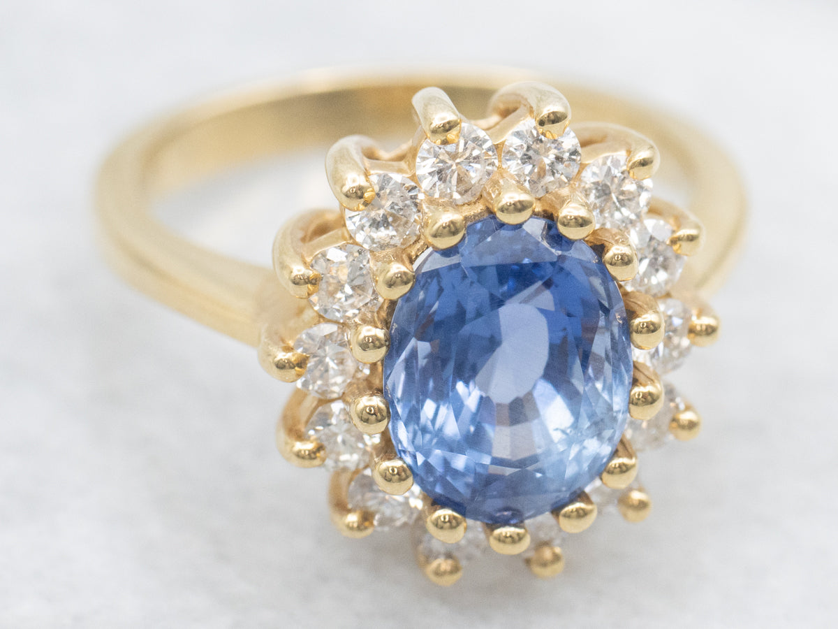 Pretty Blue Sapphire and Diamond Halo Cocktail Ring