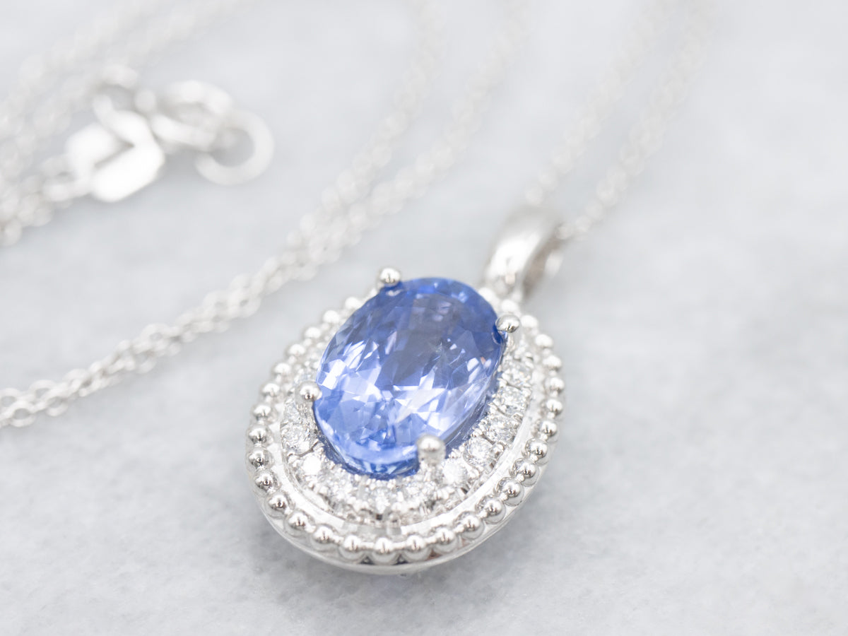 Modern Sapphire and Diamond Halo Pendant Necklace